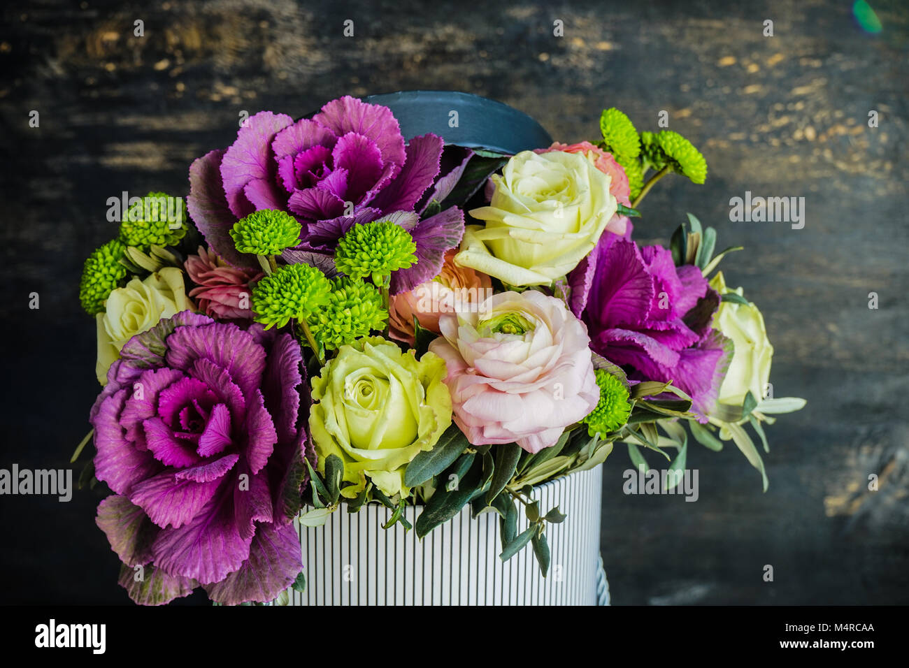 Beautiful bouquet in vintage box with fresh anemone, roses, brassica ...
