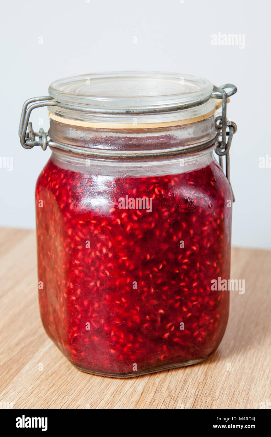 raspberry jam in jar isolated Stock Photo - Alamy