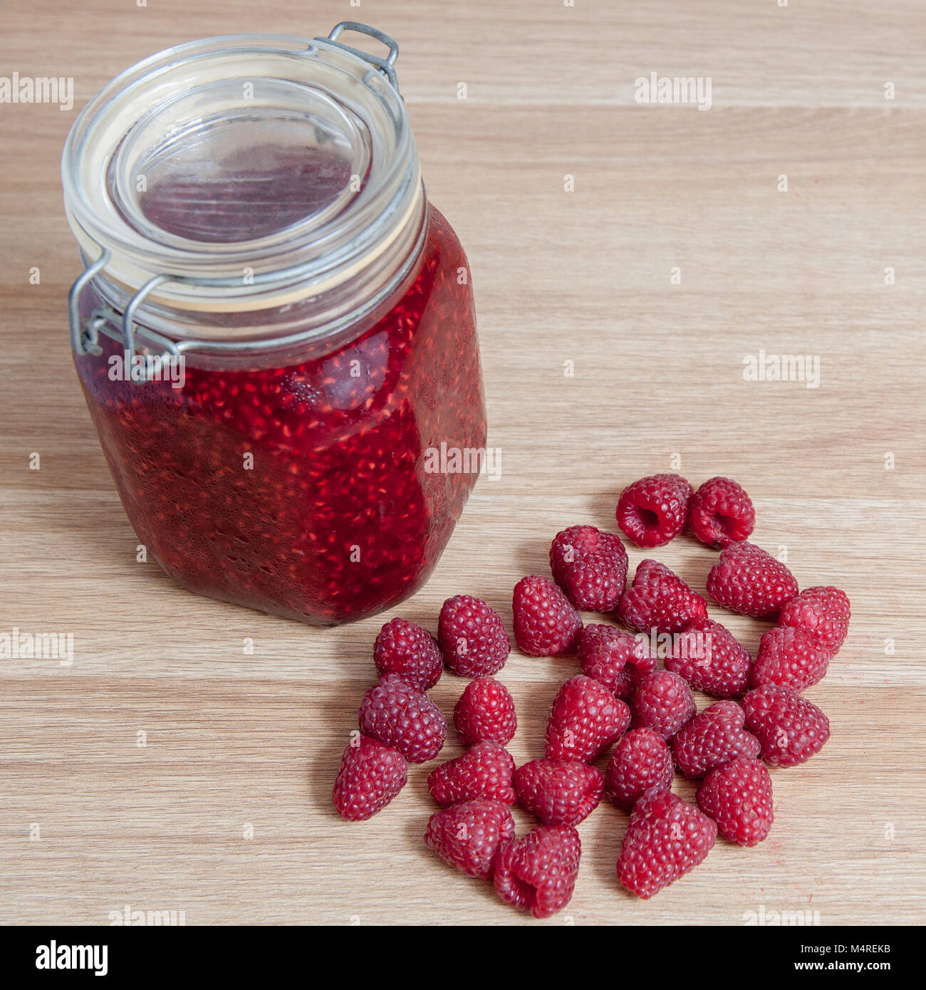 raspberry jam in jar isolated Stock Photo - Alamy
