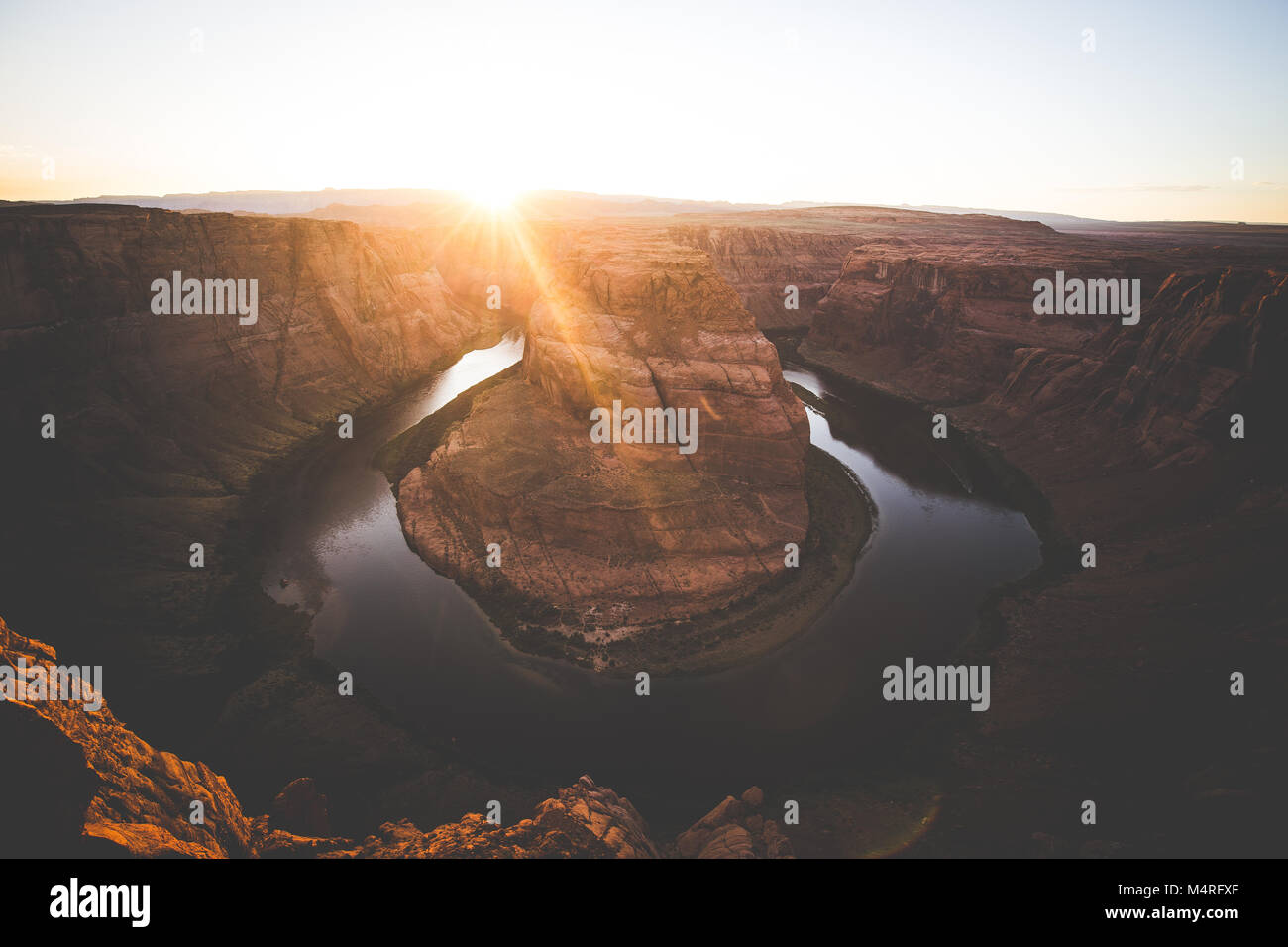 Classic wide-angle view of famous Horseshoe Bend, a horseshoe-shaped meander of the Colorado River located near the town of Page, at sunset, Arizona Stock Photo