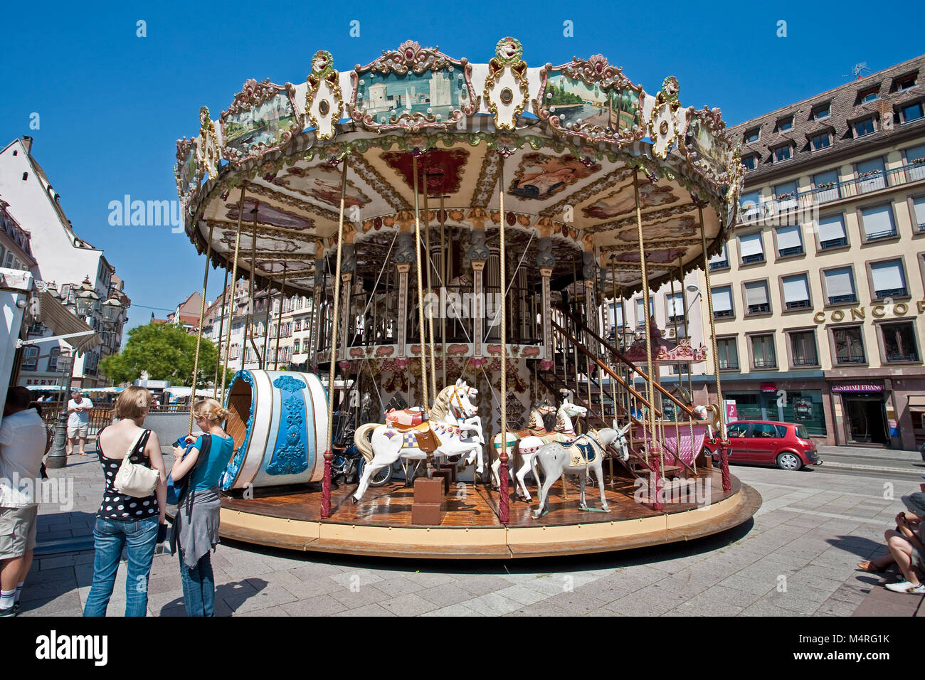 Historical roundabout, carrousel, for kids, Strasbourg, Alsace, France, Europe Stock Photo
