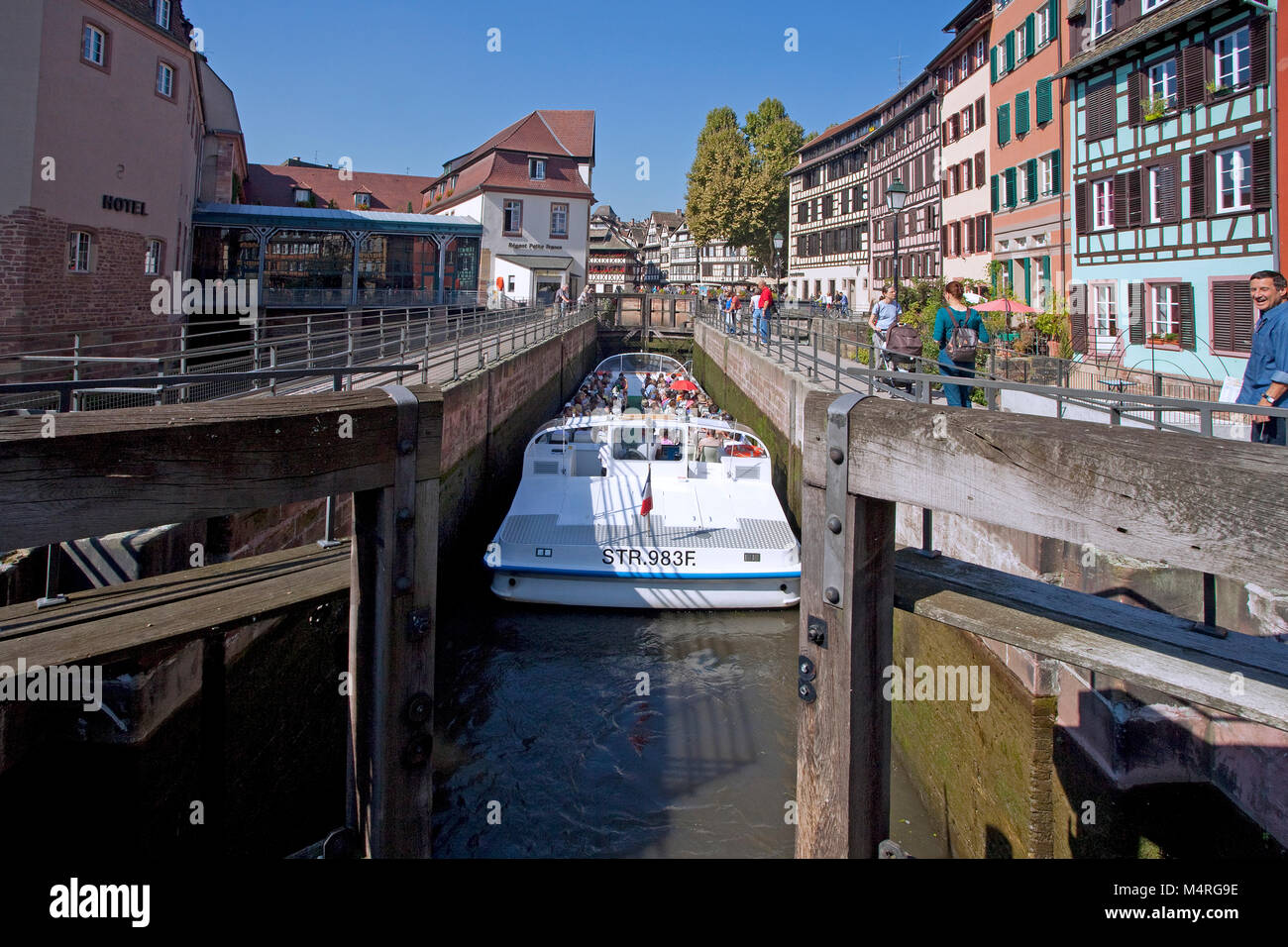 Excursion boat at floodgate of Ill river, half-timber houses, La Petite France (Little France), Strasbourg, Alsace, Bas-Rhin, France, Europe Stock Photo