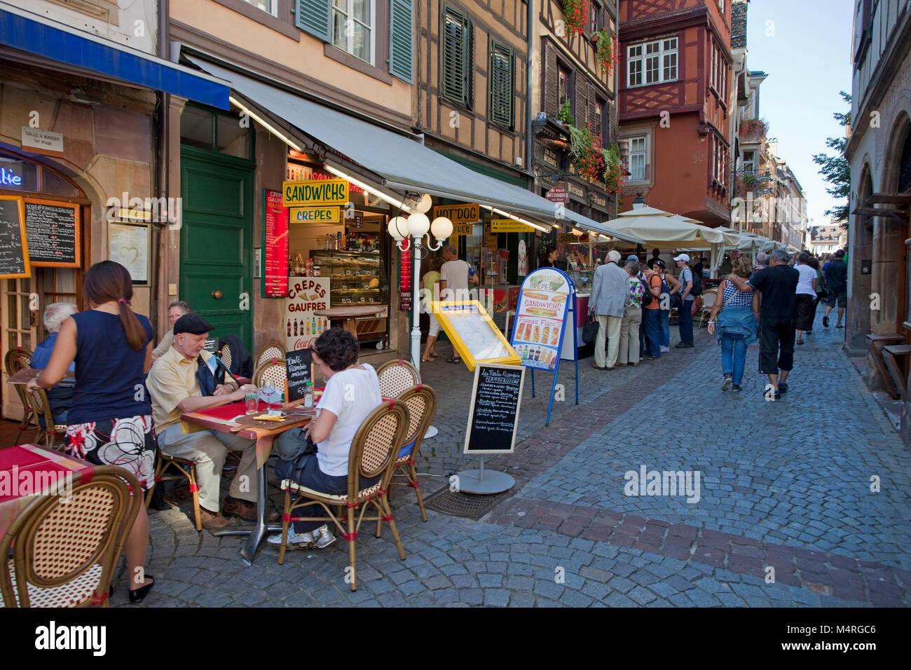 Restaurants and snack bars next to Cathedral square, Strasbourg, Alsace, Bas-Rhin, France, Europe Stock Photo