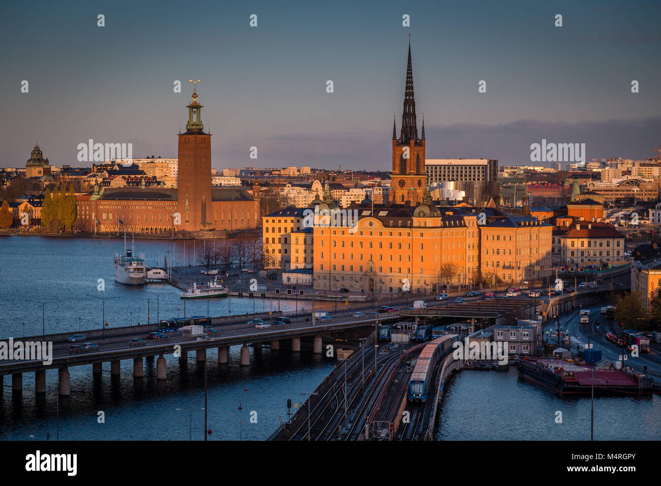 Panoramic view of famous Stockholm city center with historic Riddarholmen in Gamla Stan old town district and Stadshus (town hall) at sunrise, Soderma Stock Photo