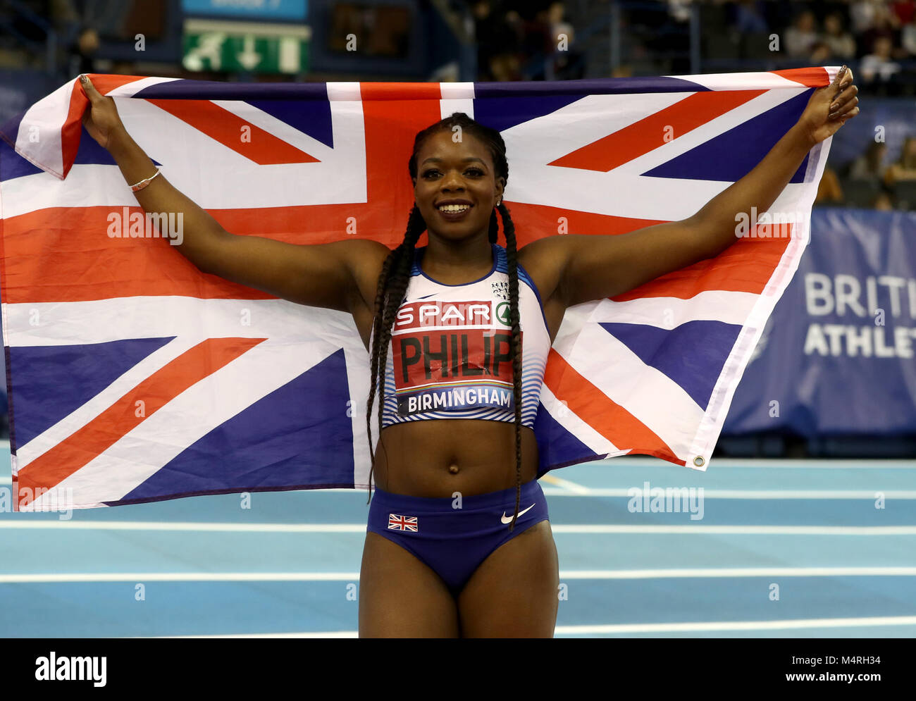 Asha Philip celebrates winning the Women's 60m during day one of the SPAR British Indoor Athletics Championships at Arena Birmingham. Stock Photo