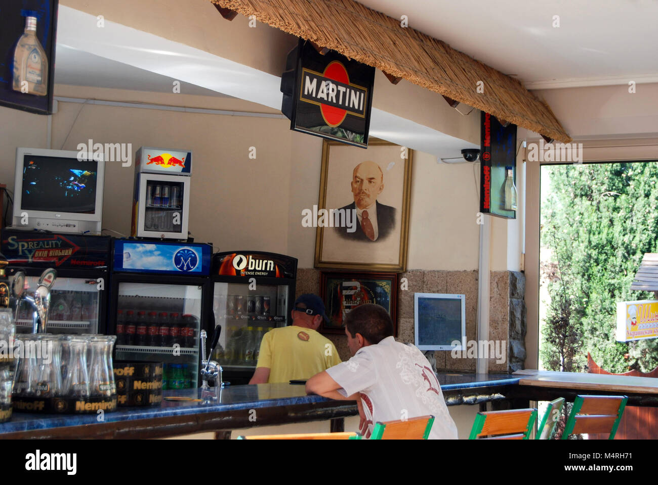 Portrait of a Vladimir Lenin, a Russian communist revolutionary, is hanging on the wall at the Soviet eatery "Factory Canteen SSSR" in Sudak, Ukraine. Stock Photo