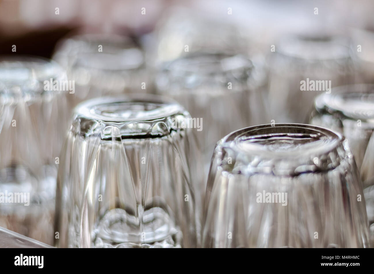 Selected focus close up on bottom of empty transparent drinking glasses