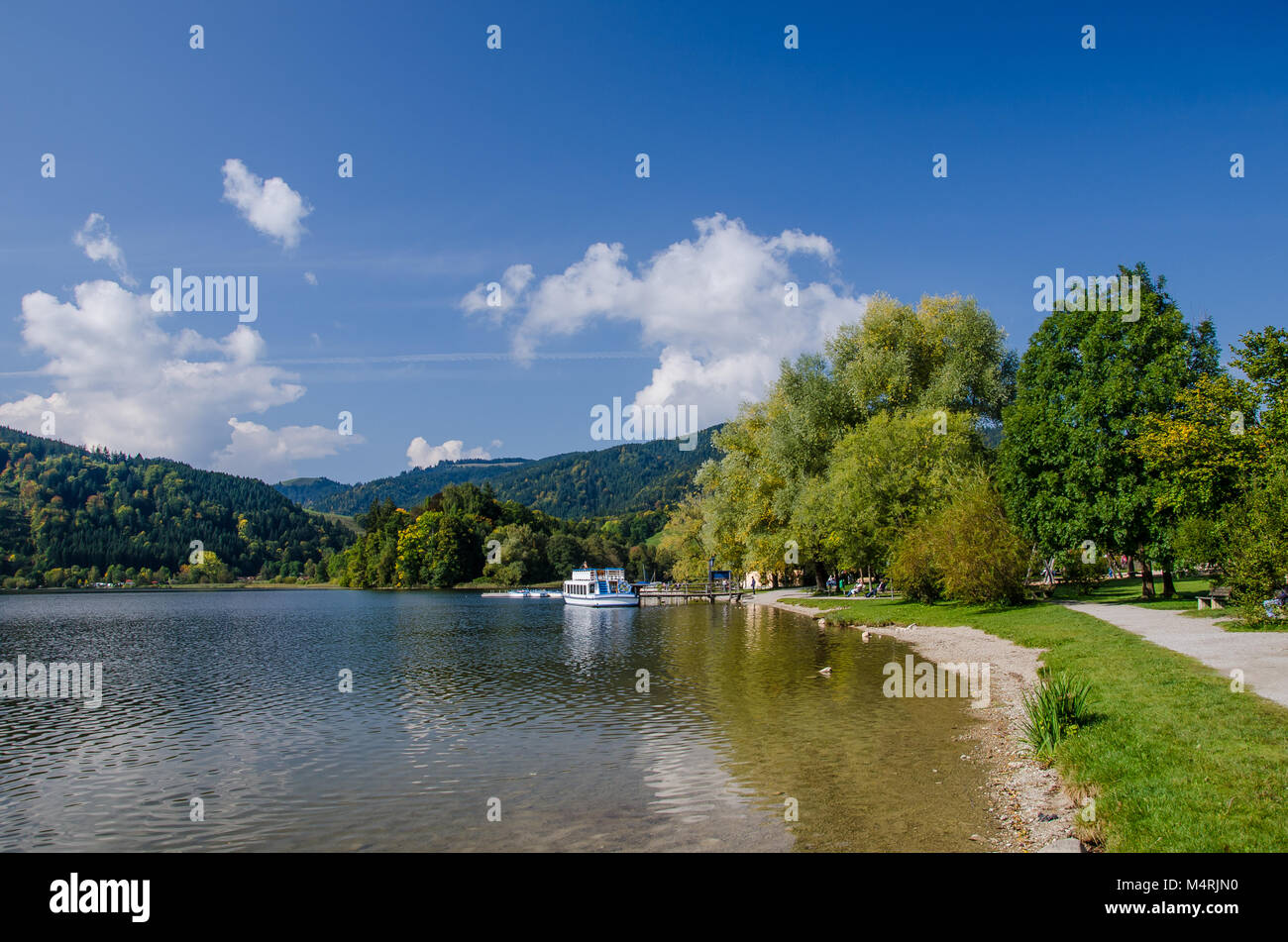 At Schliersee, one can explore the lake from a boat, which is great fun in summer. Stock Photo