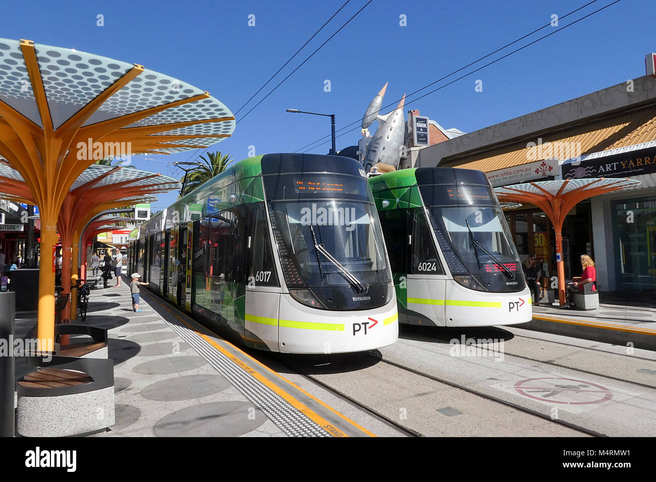 St Kilda, Melbourne, Australia: March 05, 2017: Two electric trams stationary at the Acland Street tram stop in St Kilda. Stock Photo