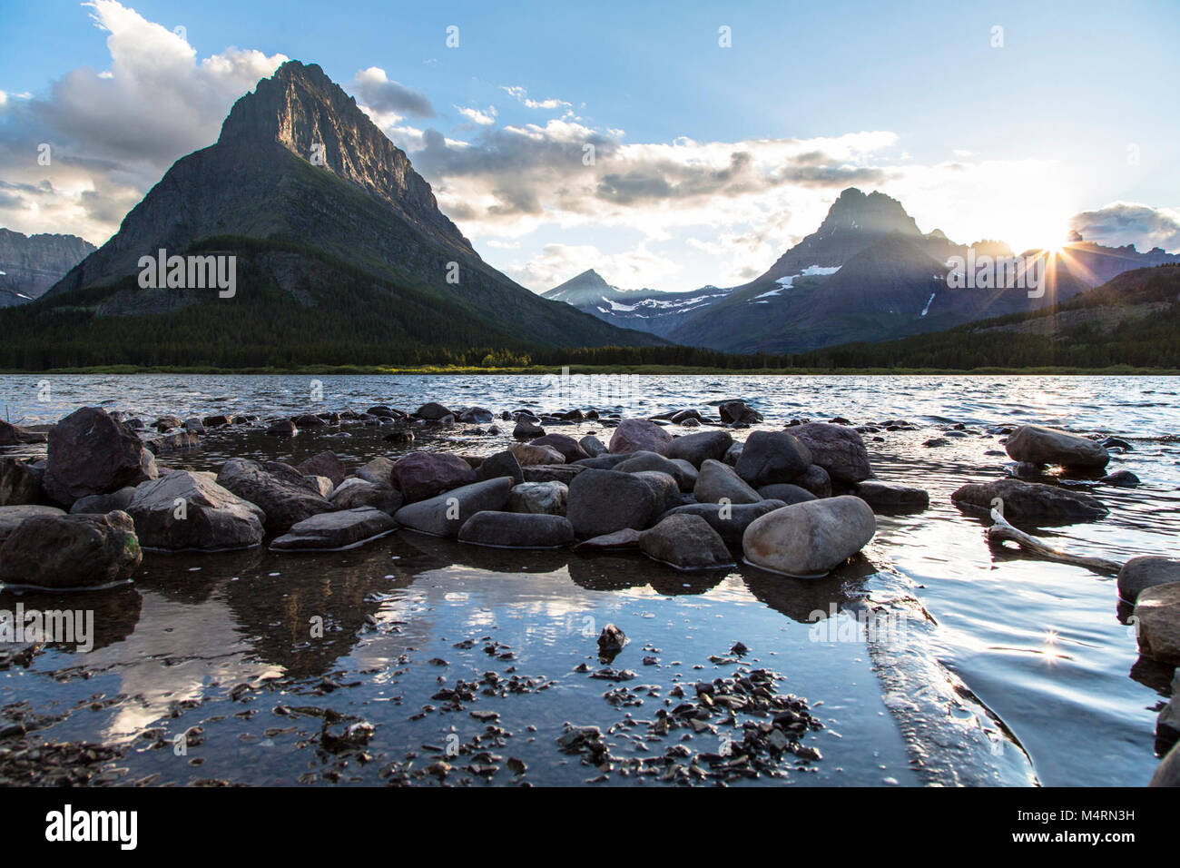 Sunset at Swiftcurrent Lake . Stock Photo