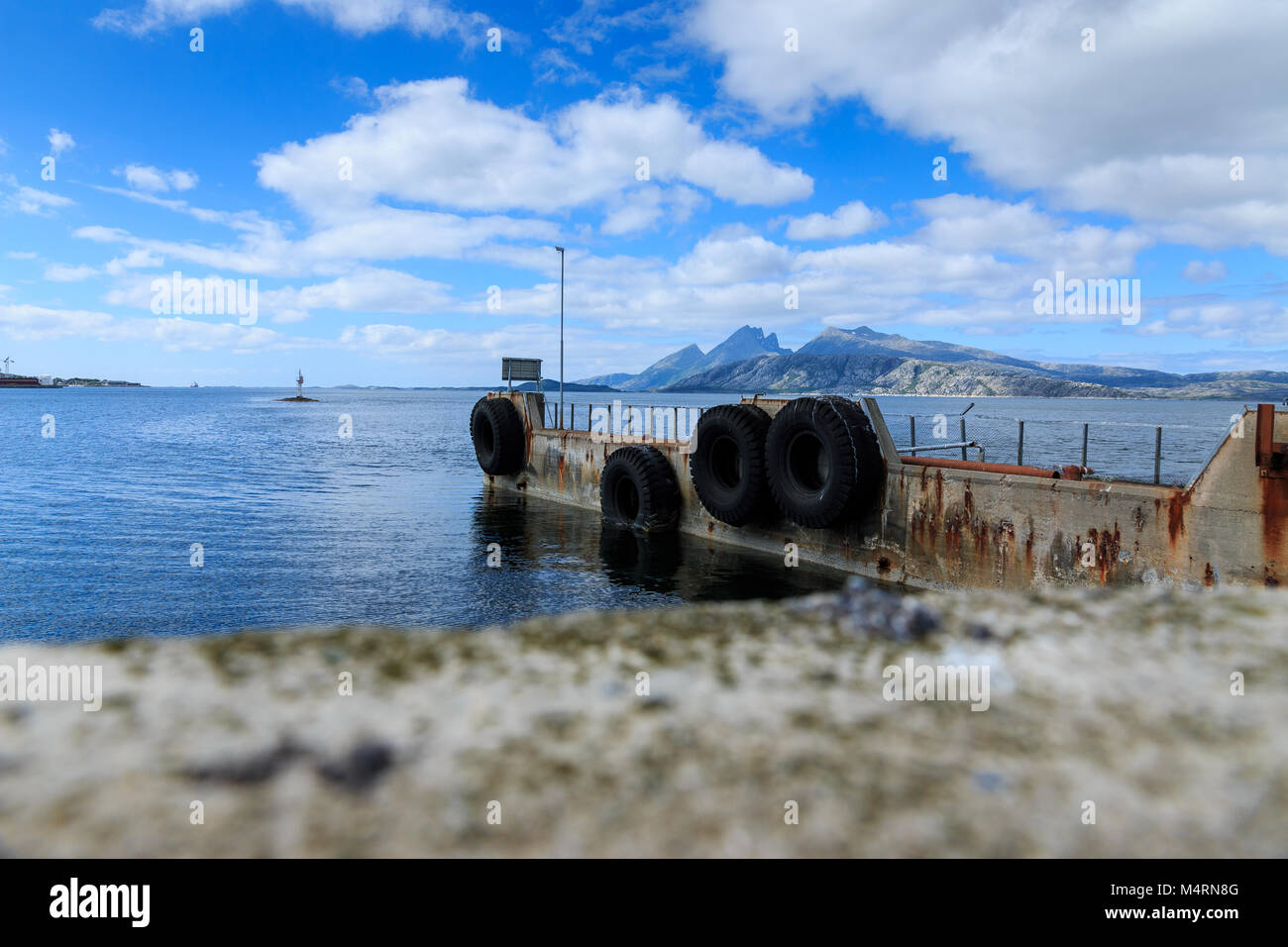 Old ferry dock in fjord in Norway, Europe Stock Photo