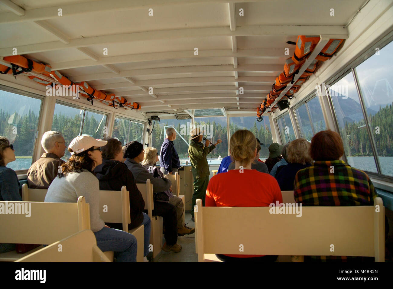 Park Ranger on a Boat Tour in Many Glacier..Park Ranger on a Boat Tour. Stock Photo