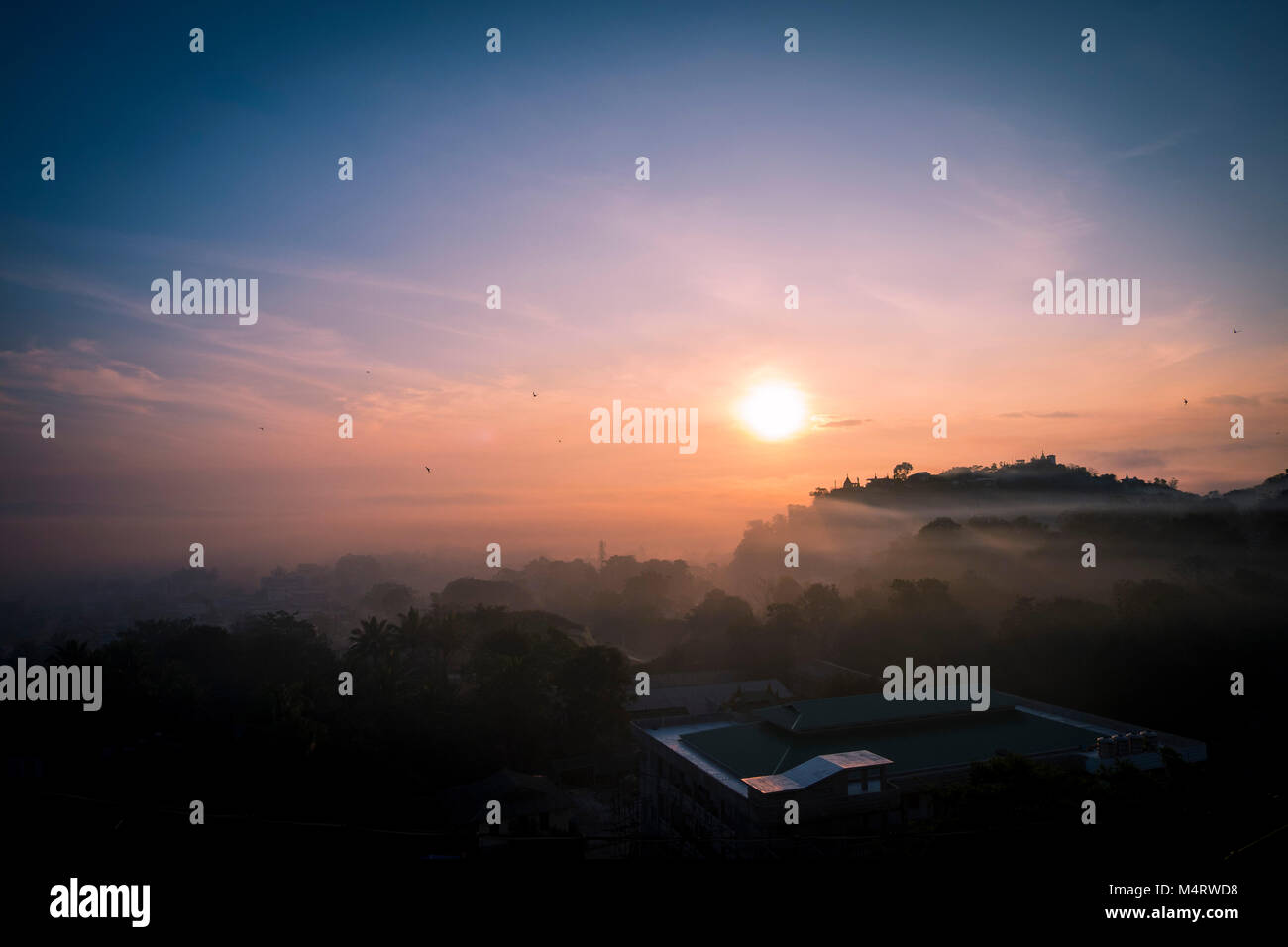 Misty sunrise in Loikaw Myanmar Stock Photo