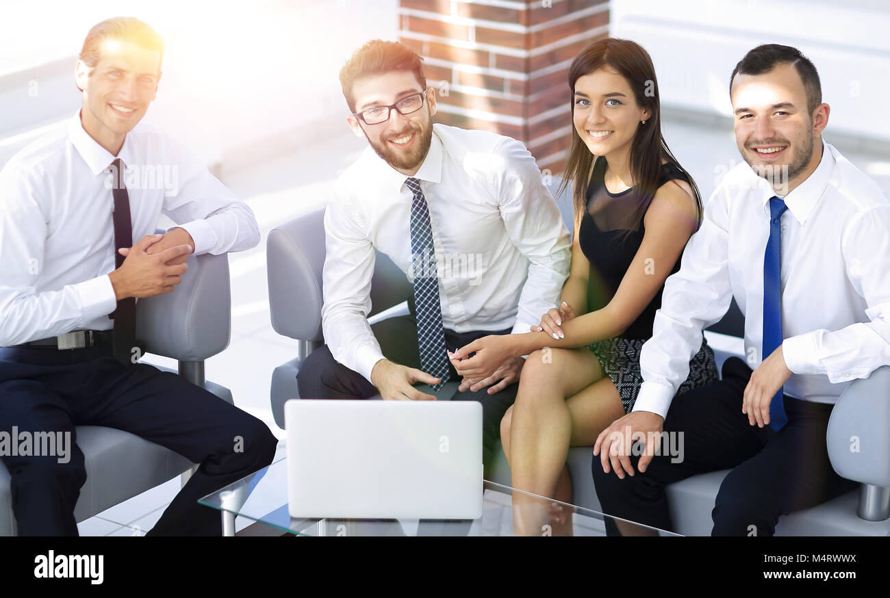 successful business team sitting in office lobby Stock Photo - Alamy