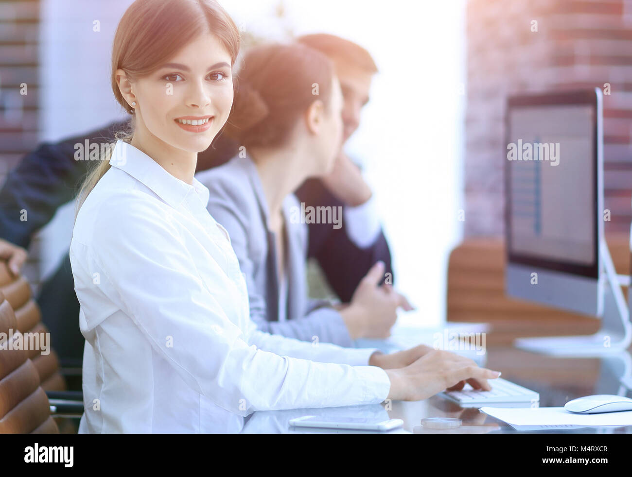 employees working on personal computers with financial data Stock Photo ...
