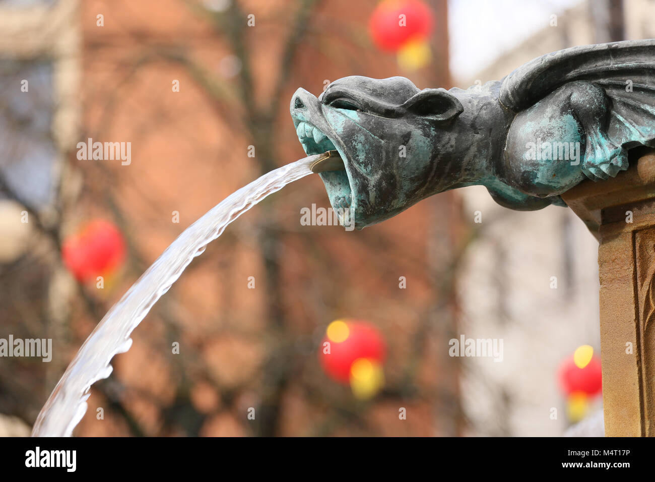 Manchester, UK. 17th Feb, 2018. A Gargoyle with water spout in front of Chinese lanterns,  Manchester, 17th February, 2018 (C)Barbara Cook/Alamy Live News Stock Photo