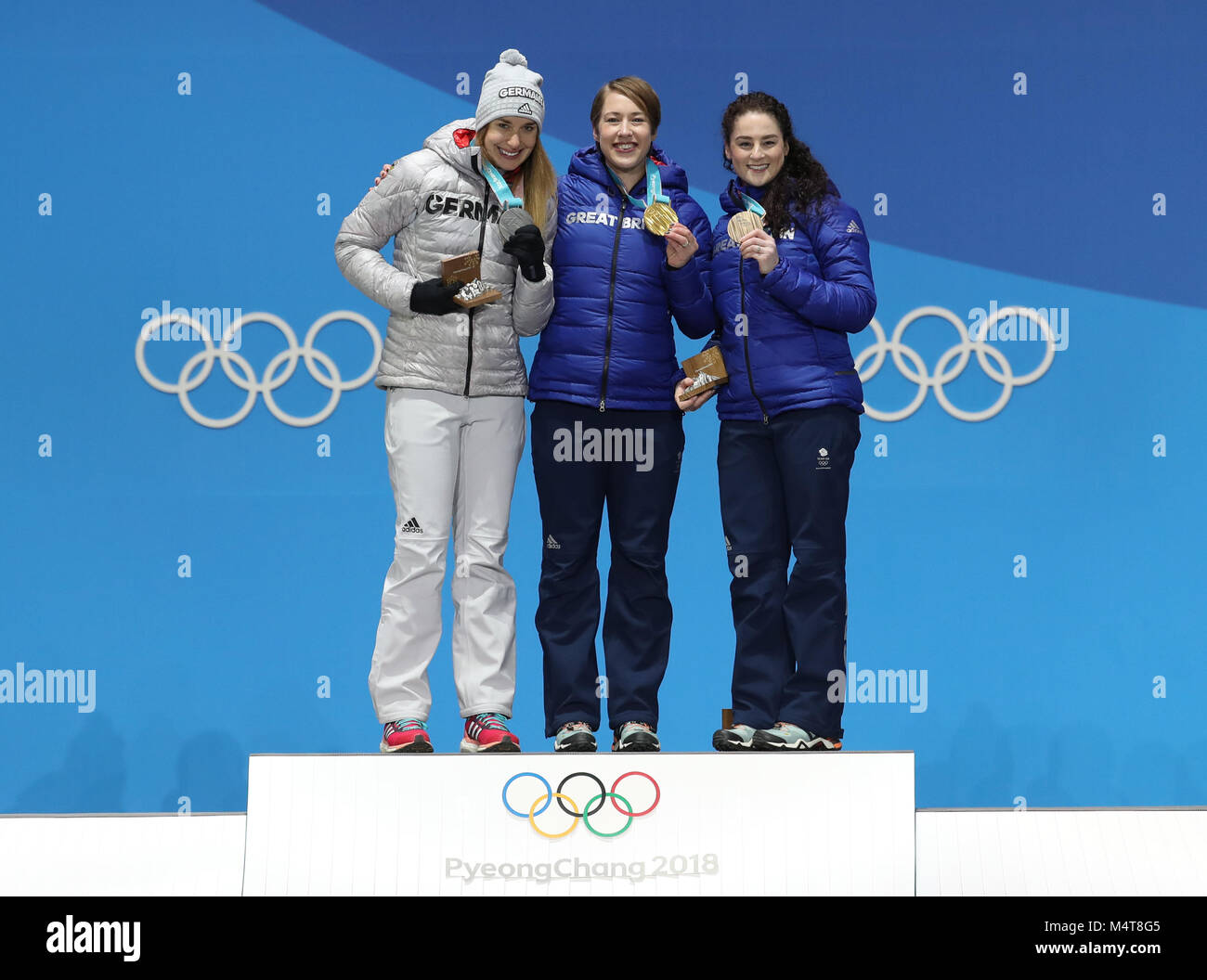 Pyeongchang, PyeongChang. 18th Feb, 2018. Champion Britain's Lizzy Yarnold (C), second-placed Germany's Jacqueline Loelling (L) and third-placed Britain's Laura Deas pose for photos during medal ceremony of women event of skeleton at 2018 PyeongChang Winter Olympic Games at Medal Plaza, PyeongChang, Feb. 18, 2018. Credit: Li Gang/Xinhua/Alamy Live News Stock Photo