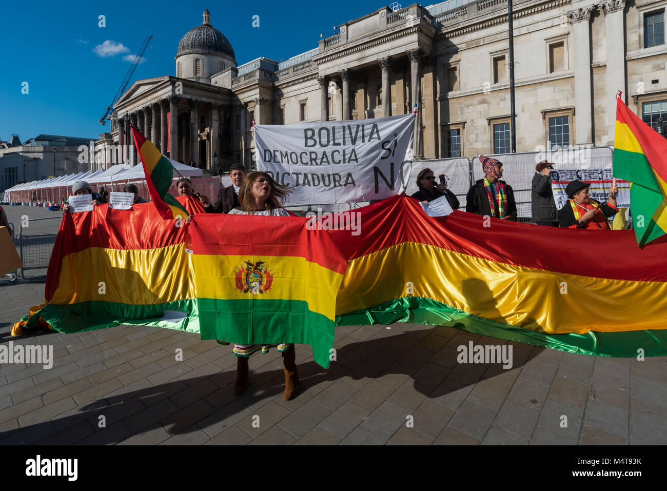 February 17, 2018 - London, UK. 17th February 2018. Bolivians protest in Trafalgar Square against President Evo Morales who won a Supreme Court appeal which will allow him to run for a fourth term in 2019 after a referendum on 21st February 2016 had voted down the constitutional change. The government argued it had lost because of an illegal defamatory campaign against Morales who is the country's first indigenous leader, in office since 2006, and says he needs more time in power in order to consolidate his party's programme of of social reforms. The protesters accuse him of wanting to be a d  Stock Photo