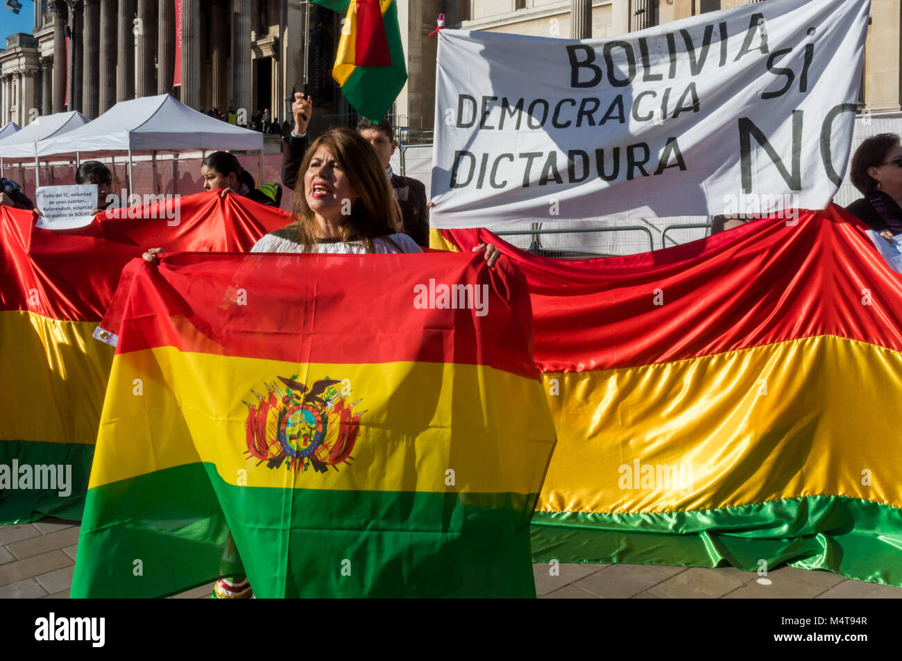 February 17, 2018 - London, UK. 17th February 2018. Bolivians protest in Trafalgar Square against President Evo Morales who won a Supreme Court appeal which will allow him to run for a fourth term in 2019 after a referendum on 21st February 2016 had voted down the constitutional change. The government argued it had lost because of an illegal defamatory campaign against Morales who is the country's first indigenous leader, in office since 2006, and says he needs more time in power in order to consolidate his party's programme of of social reforms. The protesters accuse him of wanting to be a d  Stock Photo