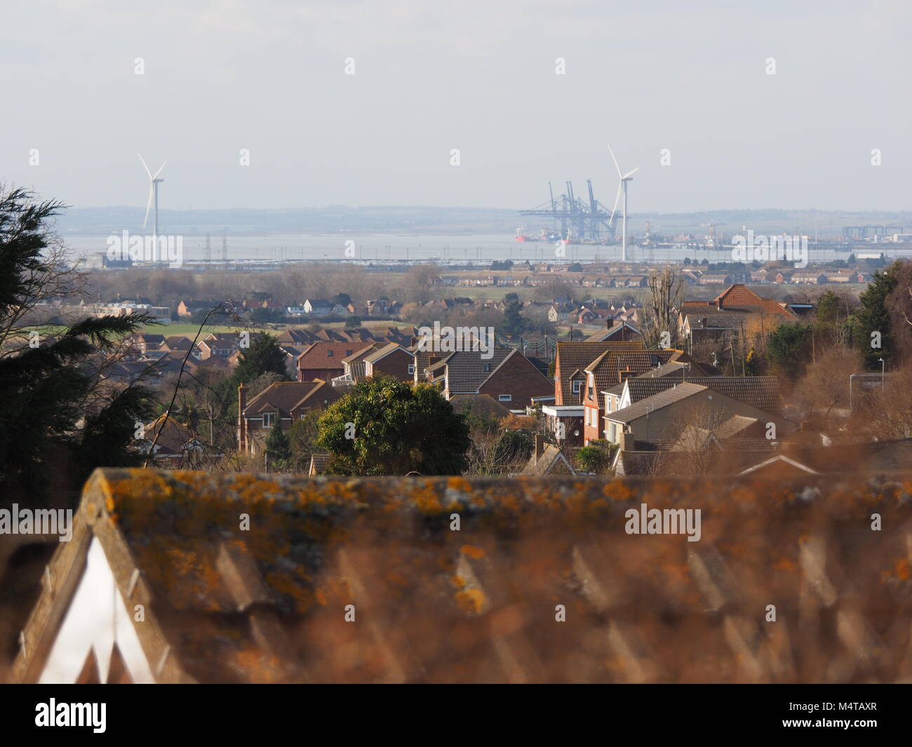 Minster on sea, Kent, UK. 18th Feb, 2018. UK Weather: another sunny and warm day in Minster on sea on the Isle of Sheppey in north Kent. Temp: 10c. View towards London Thamesport. Credit: James Bell/Alamy Live News Stock Photo