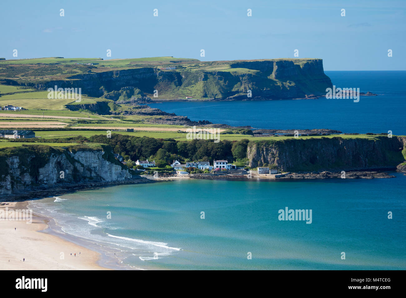 View across White Park Bay and Portbraddan, Causeway Coast, County Antrim, Northern Ireland. Stock Photo