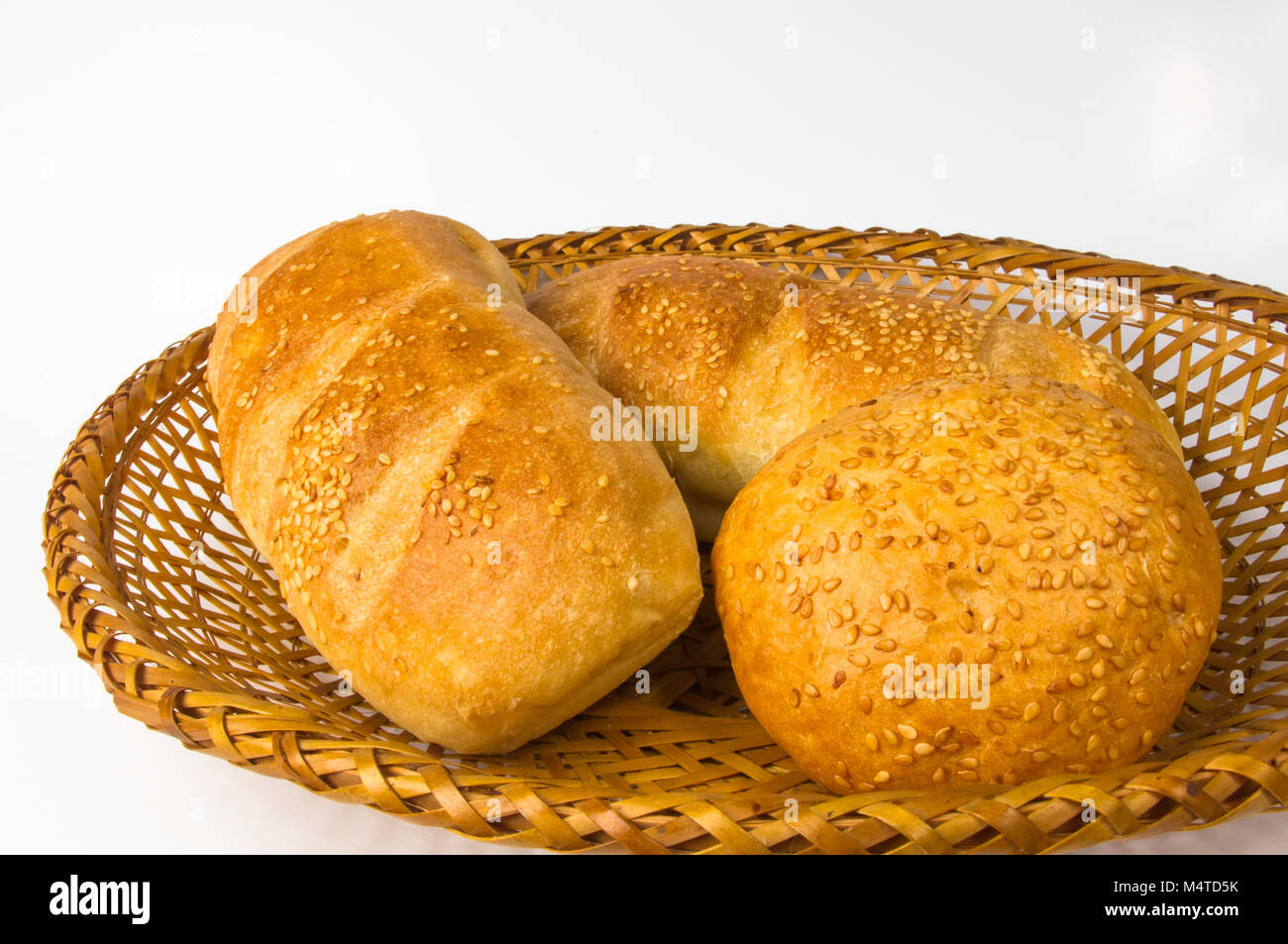 whole wheat breads and bun on a wicker plate Stock Photo - Alamy