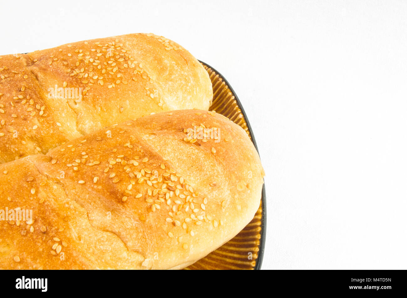 whole wheat breads on a brown plate Stock Photo - Alamy