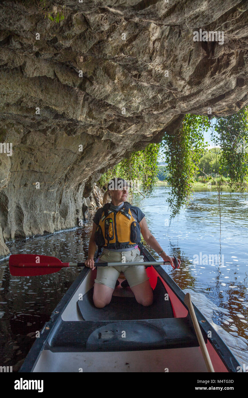Canoeist beneath a limestone cliff, Blackwater River, Mallow, County