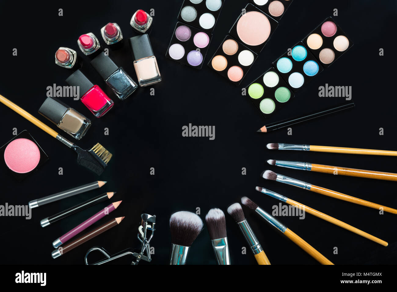 Professional Makeup Brushes And Make-up Products Set On Black Background Stock Photo