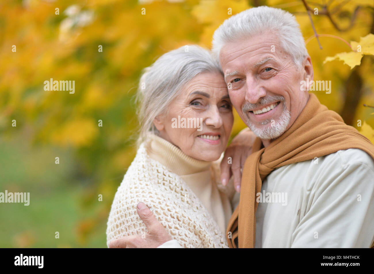 beautiful caucasian senior couple in the park Stock Photo - Alamy