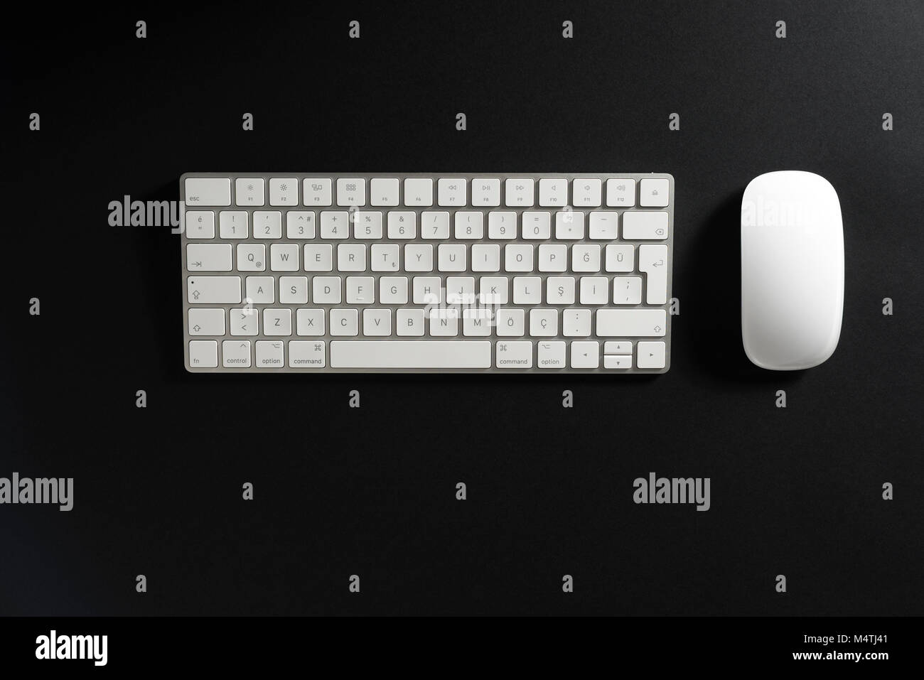 Wireless Keyboard and mouse on a black background. Stock Photo