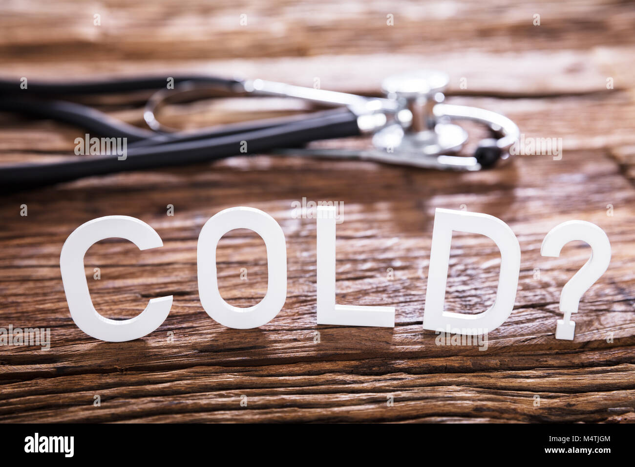 Close-up Of A Cold Text With Question Mark Sign On Wooden Background ...