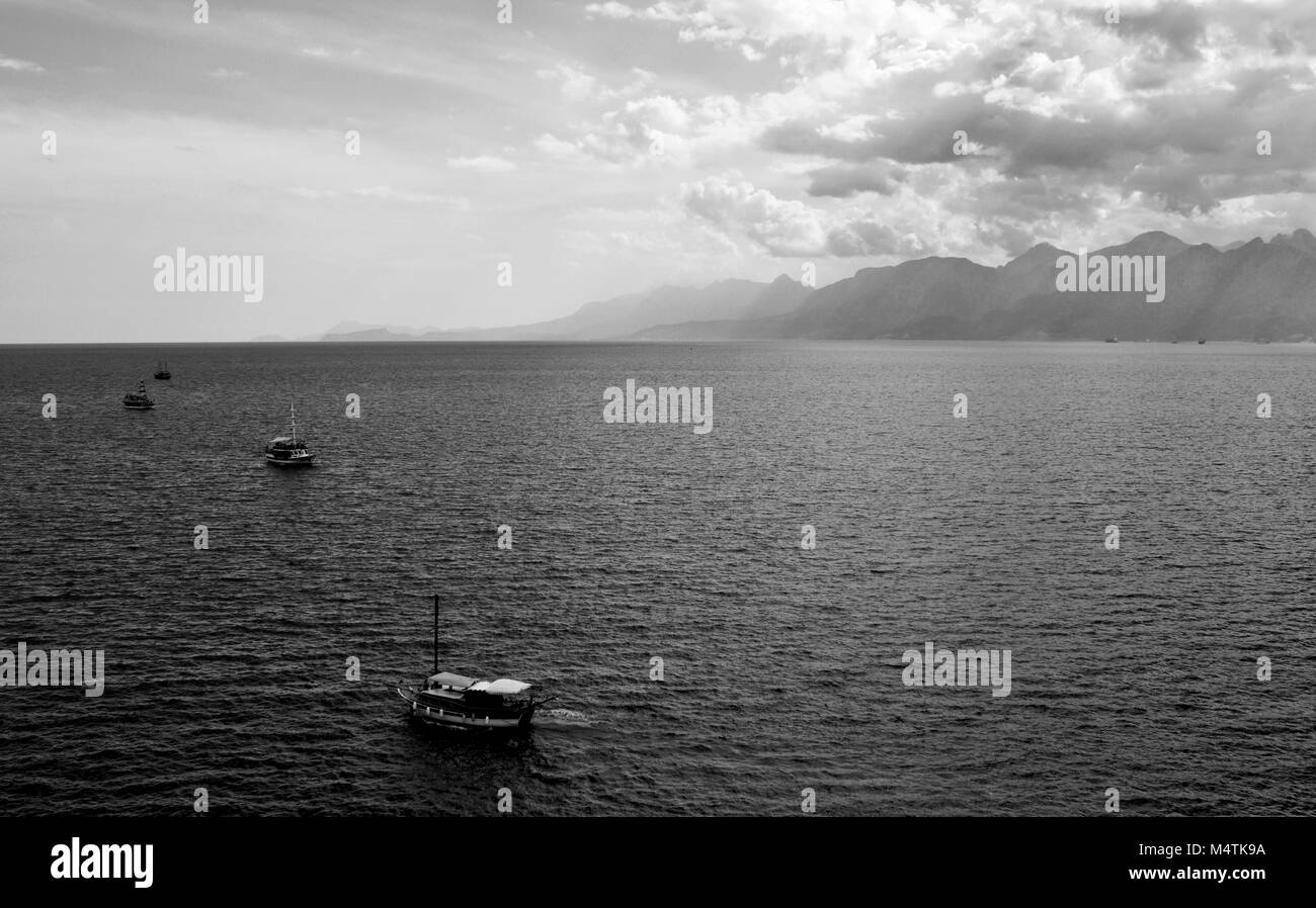 1, 2, 3...Boats in tranquil waters off Antalya. Stock Photo