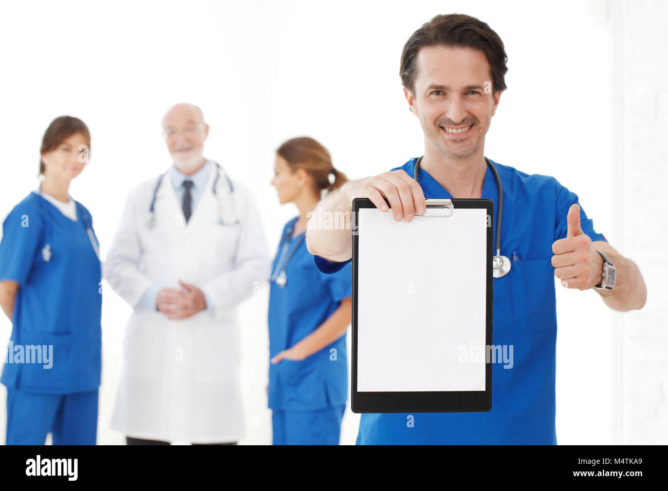Group of doctors isolated on white background, studio shot Stock Photo