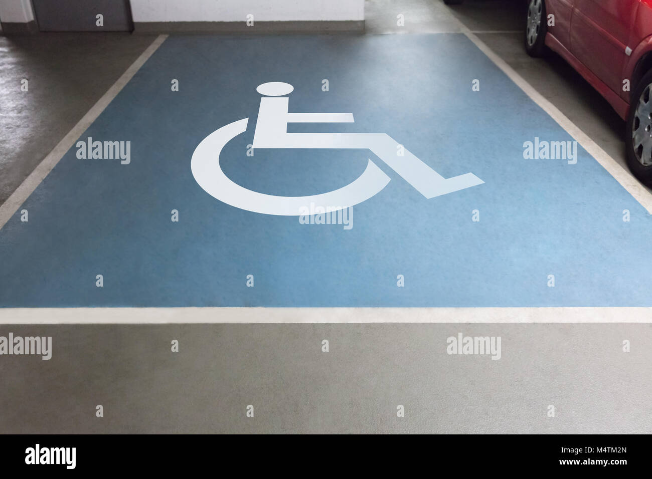 High angle view of handicap sign for parking in garage Stock Photo