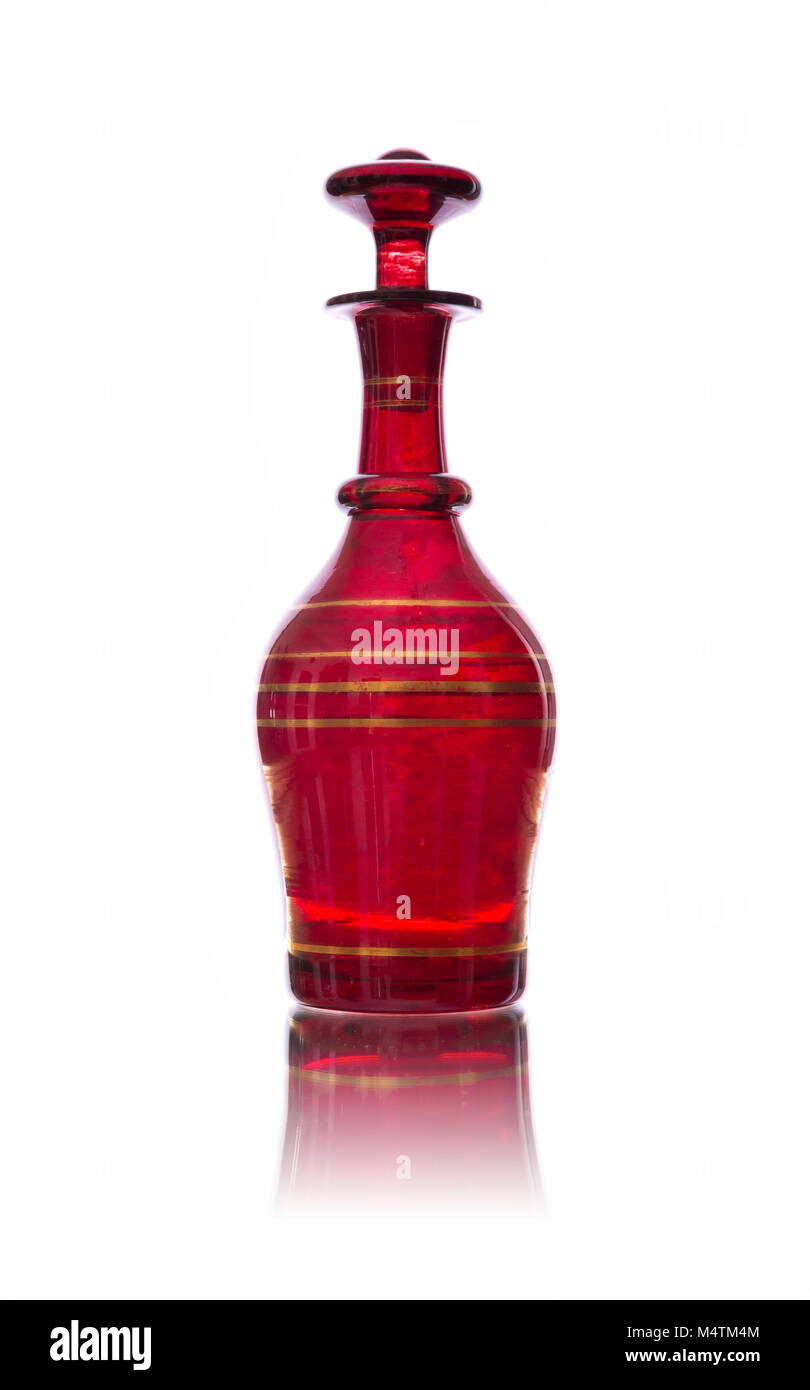 Antique red glass carafe isolated on white backround Stock Photo