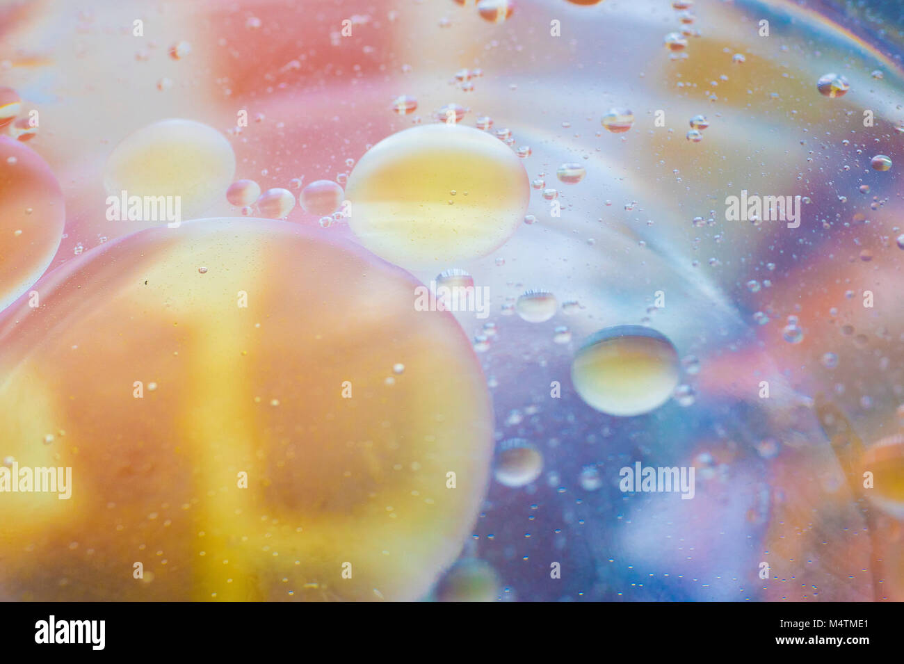 Random subject photographed close up macro shots of coloured bubble from water and oil mixed together Stock Photo