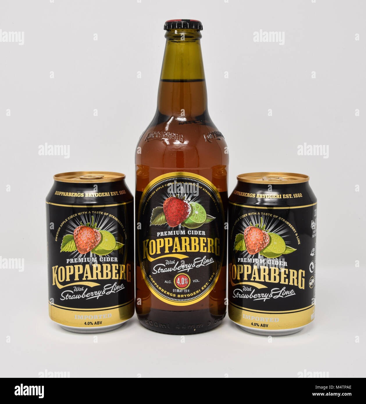 Reading, United Kingdom - January 13 2018:   A bottle and two cans of Strawberry and lime fruit cider by Kopparberg Stock Photo