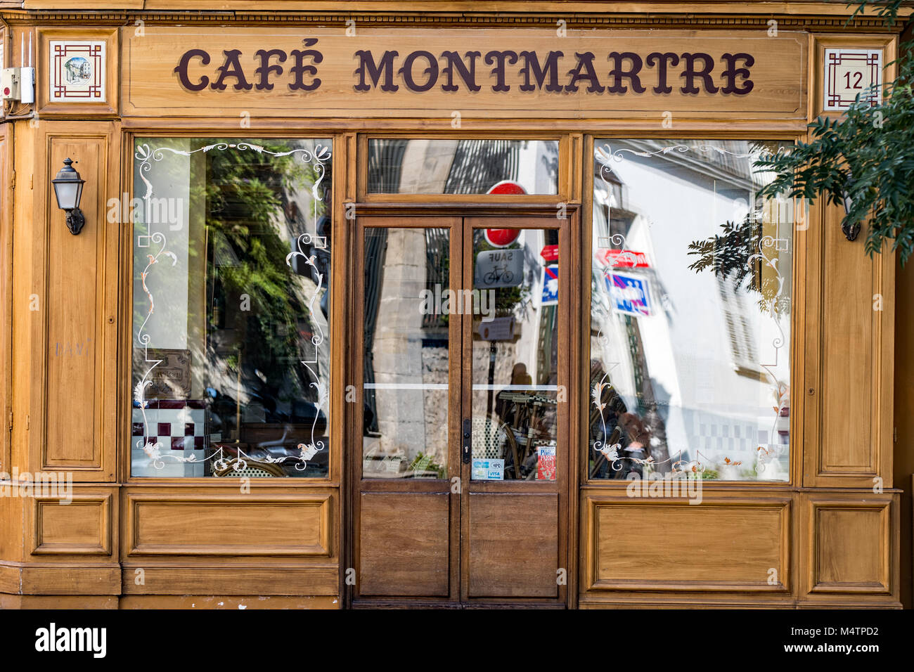 The facade of traditional bistro in Paris Stock Photo