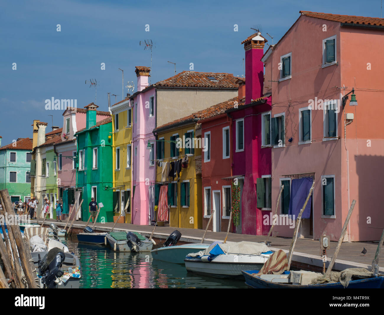 Burano Venice Italy canal lined with colorful homes Stock Photo - Alamy