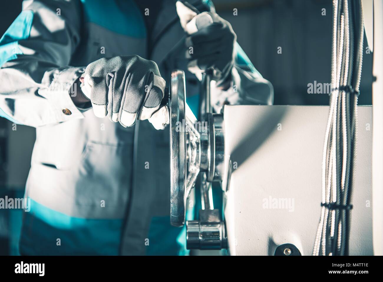 Metal Lathe Worker Adjusting Machine. Metalworking Industry Theme Stock