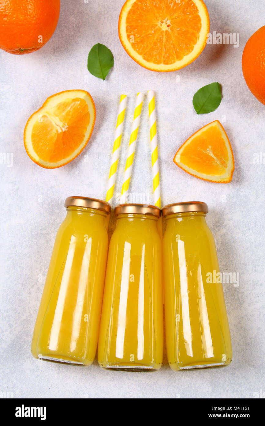 Download Glass Bottles With Fresh Orange Juice With Orange Slices And Yellow Stock Photo 175108132 Alamy Yellowimages Mockups