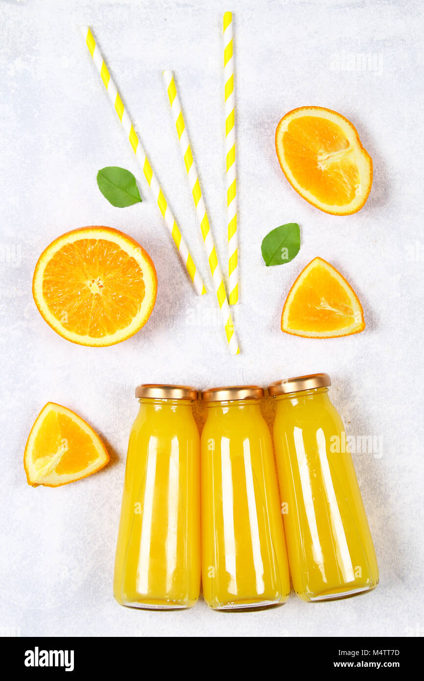 Download Glass Bottles With Fresh Orange Juice With Orange Slices And Yellow Stock Photo Alamy PSD Mockup Templates