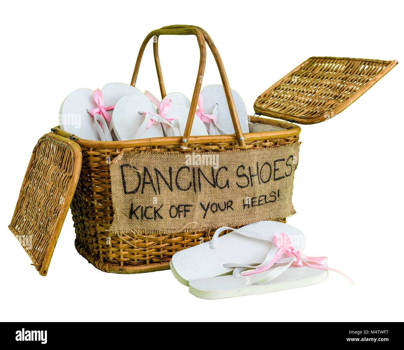 Rattan basket with white flip-flops with pink ribbon bows for guests, with  a writing DANCING SHOES. KICK OFF YOUR HEELS! White background. Square pic  Stock Photo - Alamy