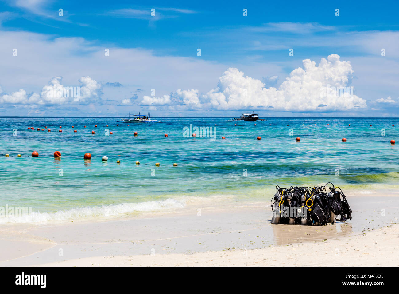 Scuba diving gear laying on the sand on White Beach, Boracay Island, Philippines Stock Photo