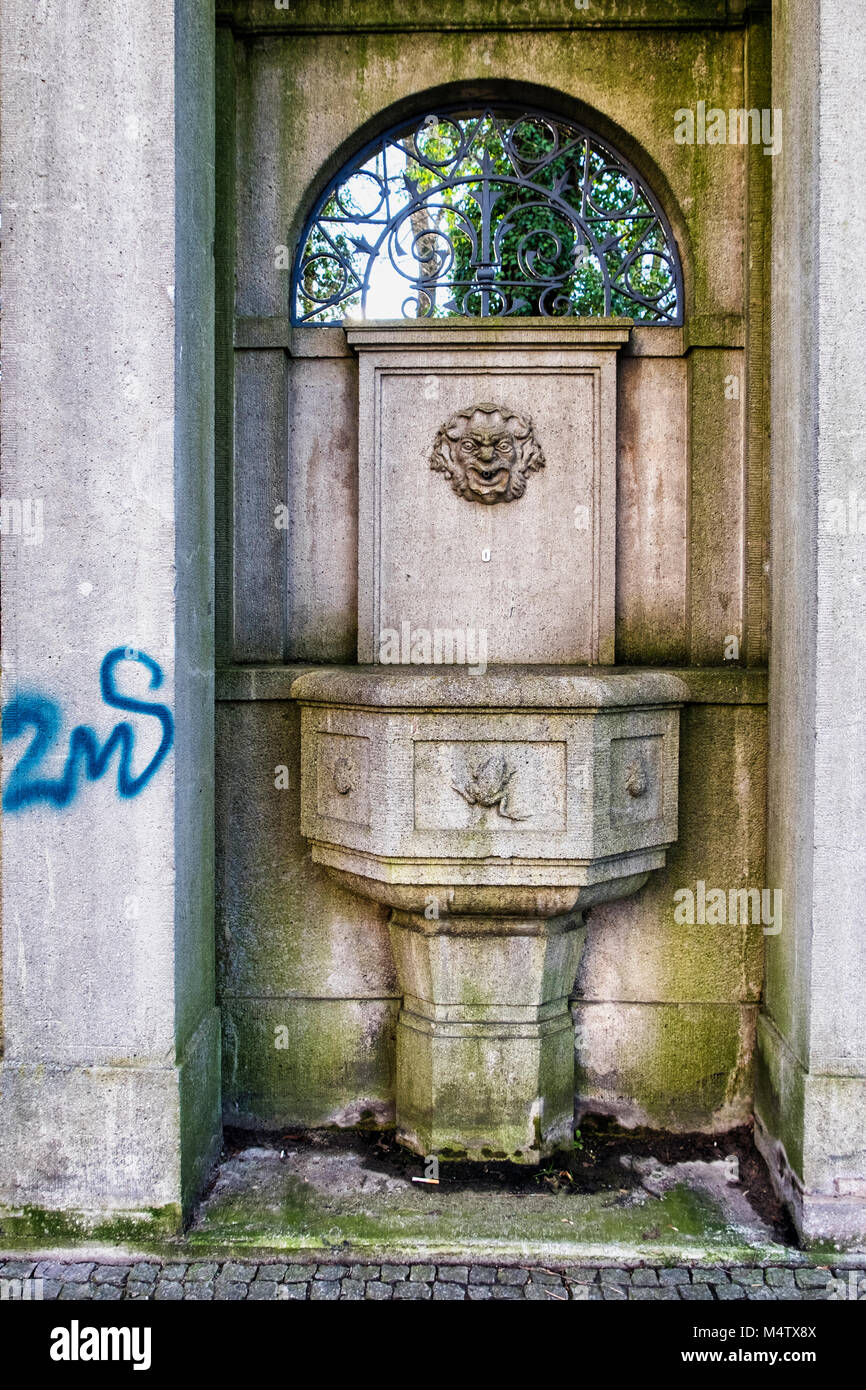 Bürgerpark Pankow Berlin.Old graffiti covered fountain on bridge across Panke river at edge of park Stock Photo
