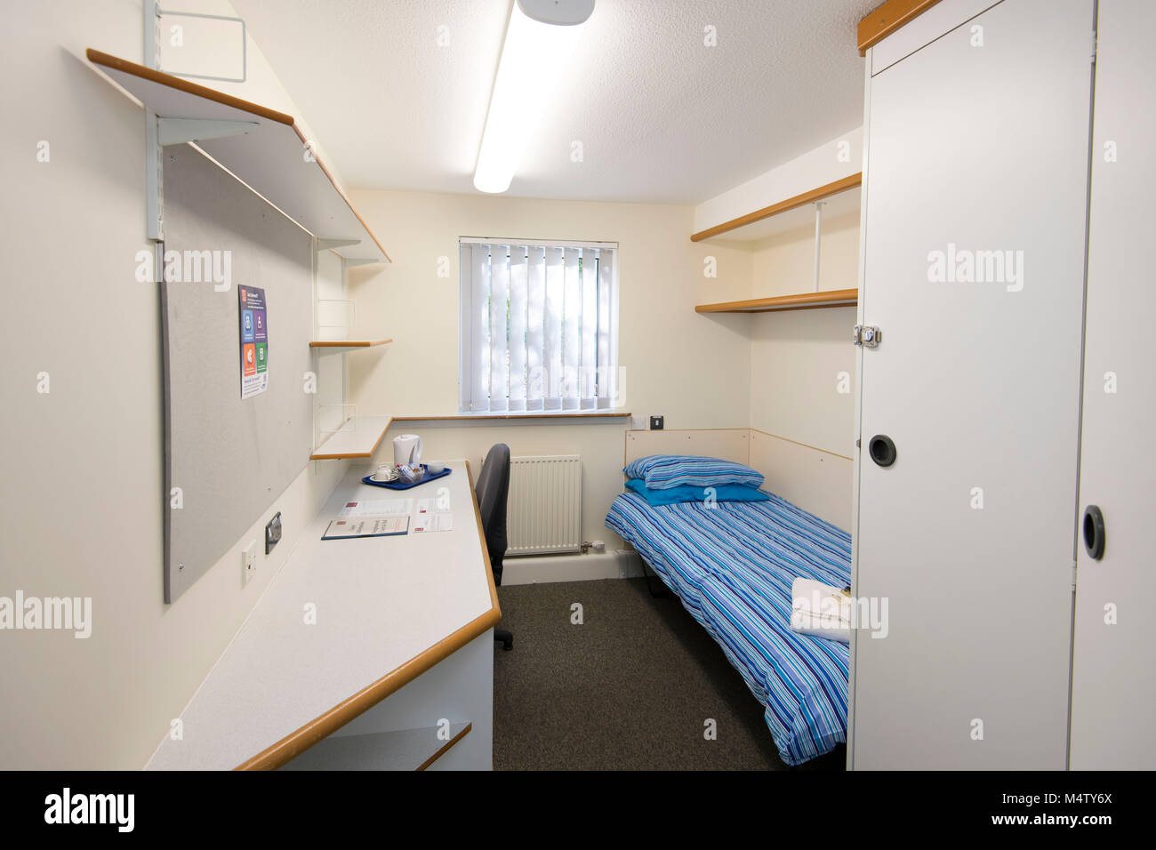 Small bedroom and study student area in university halls