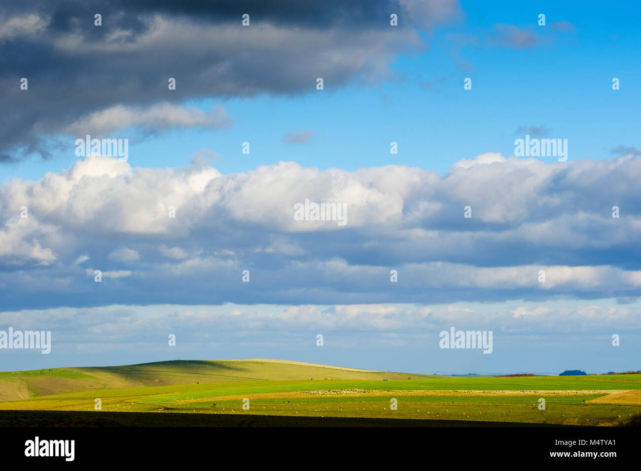 Clouds march across the landscape over White Sheet Down in Wiltshire Stock Photo