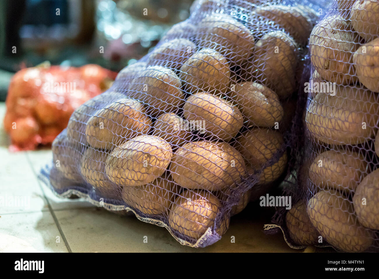 Two bags of potatoes in the basement Stock Photo Alamy