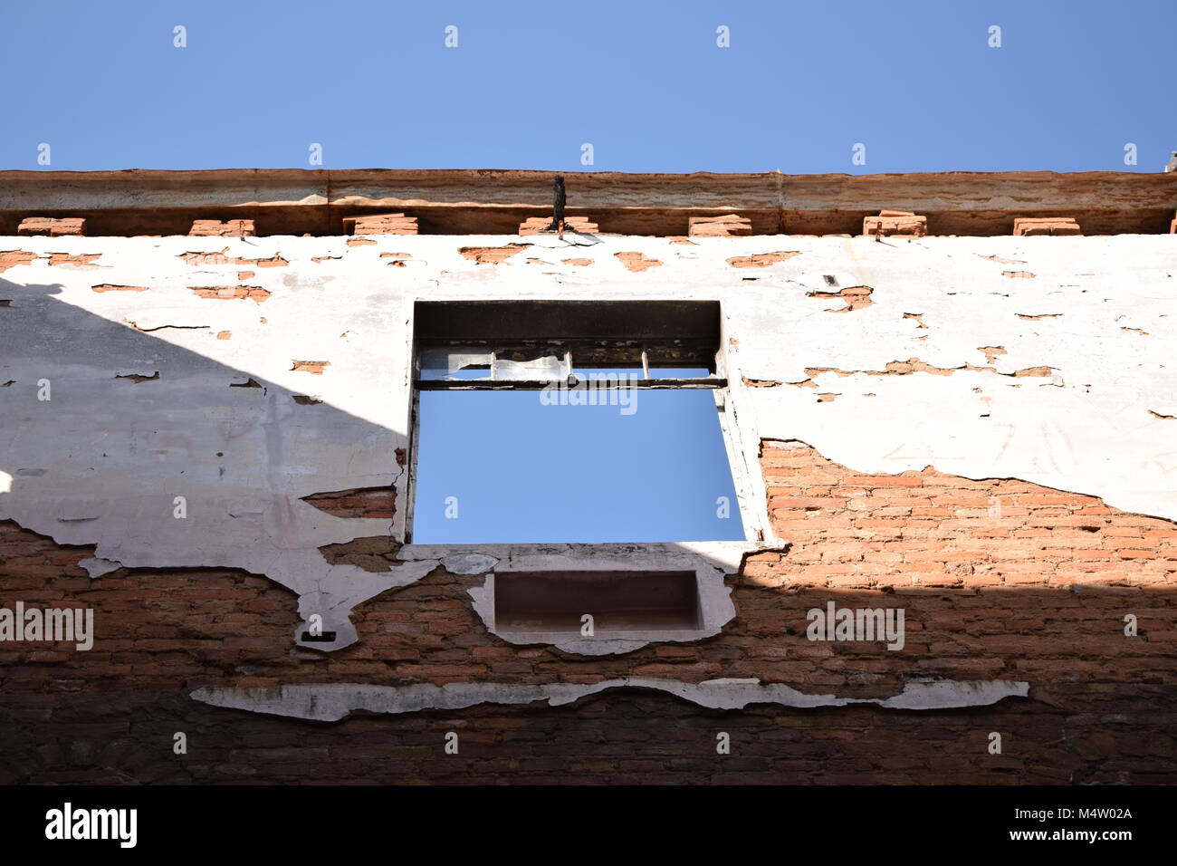 Demolition building blasting the blue sky through windows or the roof ...